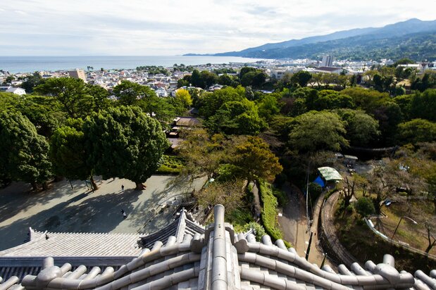 The view from the central keep observation deck, with the city below and the Izu Peninsula in the distance to the right.