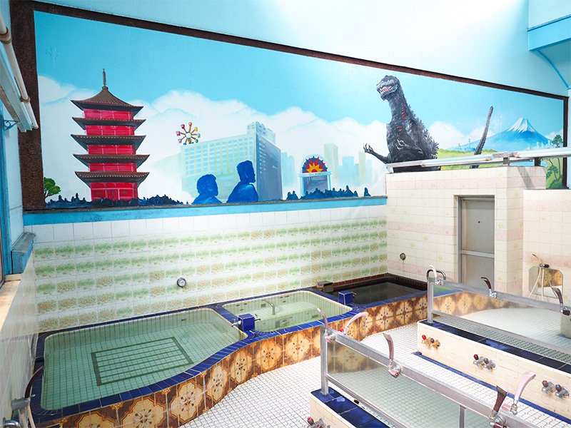 El “baño de Godzilla” en Ōta Kuroyu Onsen Daini Hinodeyu. Este mural, pintado por Tanaka, se expuso entre julio y noviembre de 2016 TM&©TOHO CO., LTD.