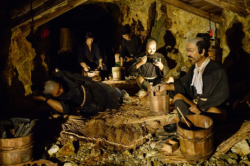 A display shows mineworkers inside the Sōdayū tunnel taking a break. Minework could be lucrative for skilled laborers.