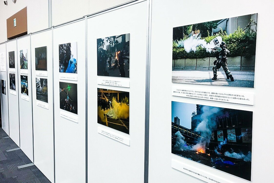 The Tokyo symposium featured a display of photos of the demonstrations taken by a Japanese photographer.