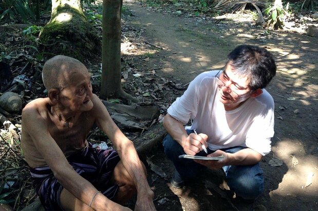 Imoto Katsuyuki interviewing a Karen elder for identification of remains in February 2014. (Courtesy Imoto Katsuyuki)