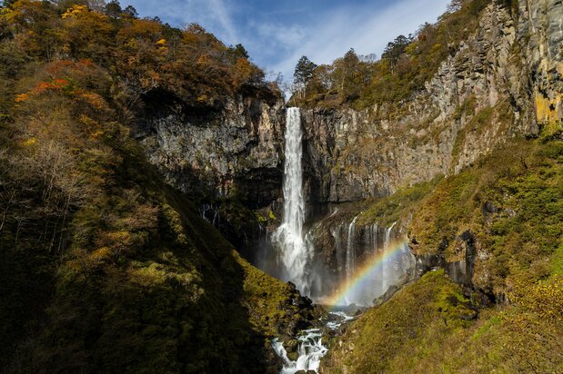 A rainbow spans the waterfall basin. This photo was taken before 9:00 am in late October.