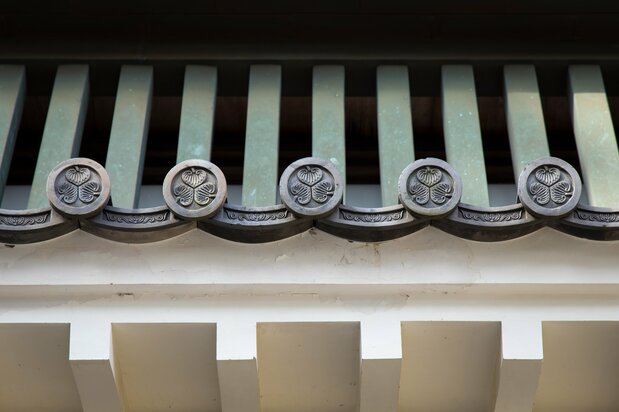 The roof tiles of the Tokiwagi Gate entrance to the main compound display the triple hollyhock of the Tokugawa clan.