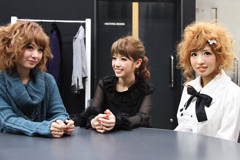 The three friends sit down together after the shoot. Their ensembles show three distinct fashion styles. To each her own!