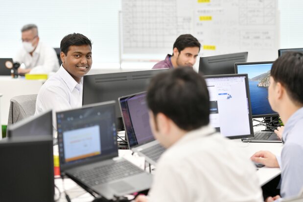 Banz (left) in his office environment.