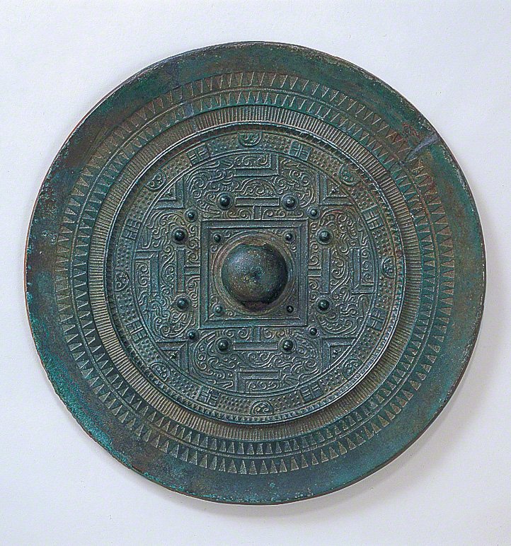 Bronze mirrors excavated at Site 17. (Courtesy of Munakata Taisha)