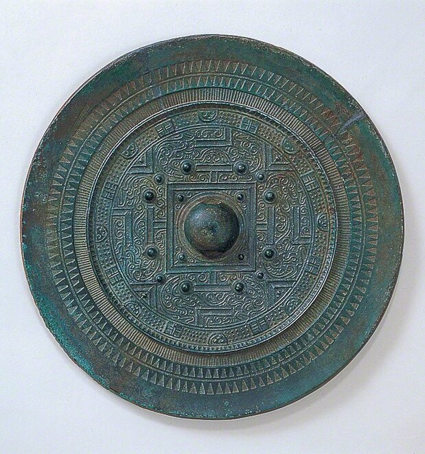 Bronze mirrors excavated at Site 17. (Courtesy of Munakata Taisha)