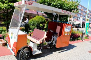 A three-wheeled pedicab
