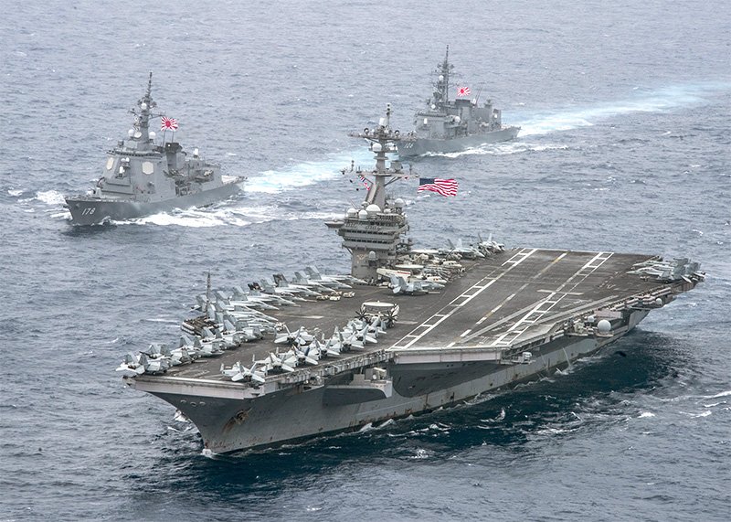 The MSDF Ashigara (top left) and Samidare accompany the USS Carl Vinson, in foreground, as it sails through the Philippine Sea on April 26, 2017. (US Navy Photo)