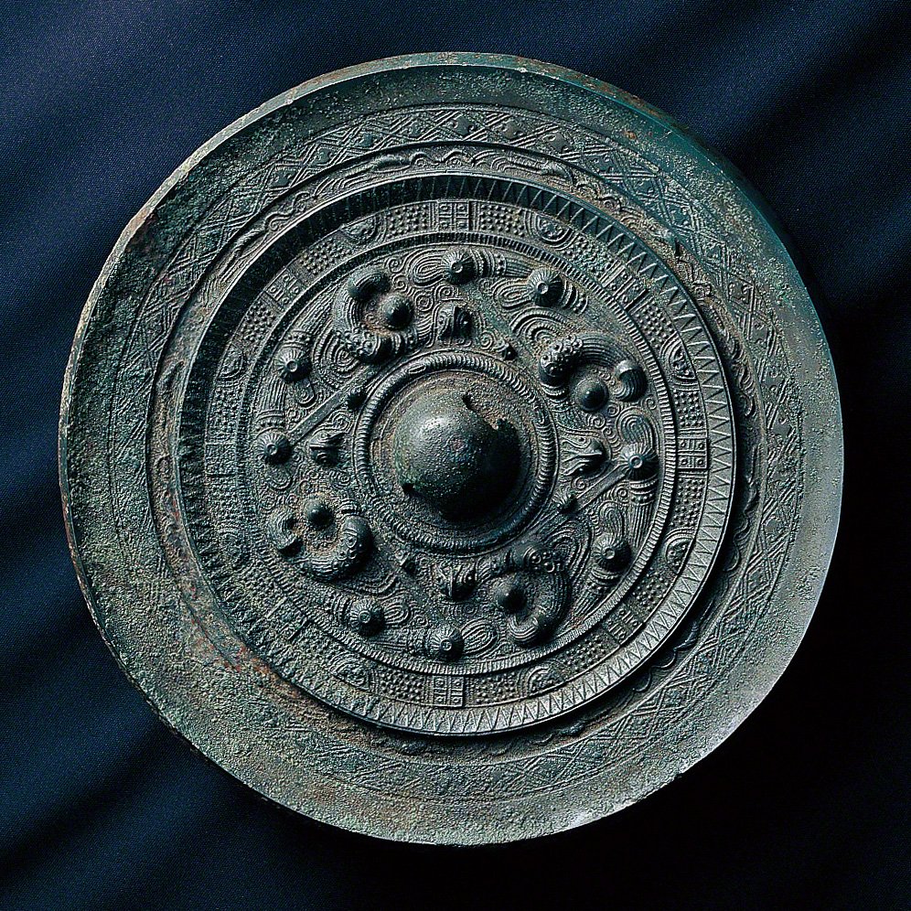 Bronze mirrors excavated at Site 17. (Courtesy of Munakata Taisha)