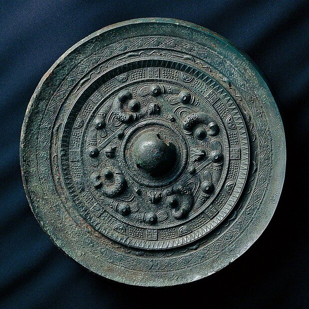 Bronze mirrors excavated at Site 17. (Courtesy of Munakata Taisha)