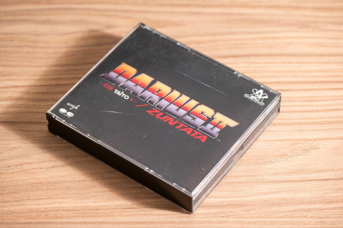 The soundtrack for Darius II, featuring the voice of Ogura’s daughter. (© Taitō Corporation, © Kodera Kei)