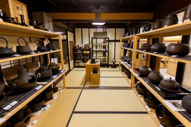 Exquisitely crafted tea ceremony wares are displayed at the rear of the store.
