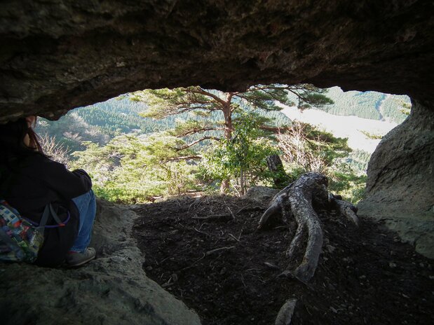 A large crevice in the hillside offers hikers a chance to sit and rest.
