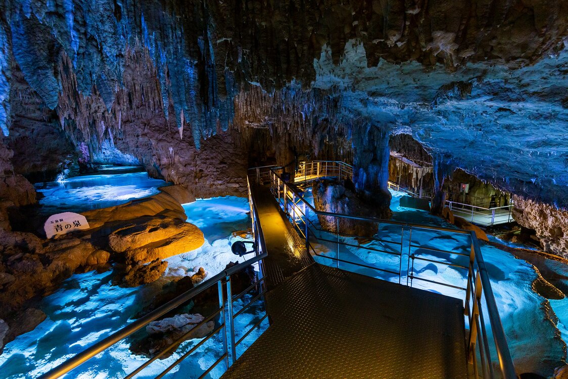 The iridescent blue Ao no Izumi is one of the many underground pools in the cave.