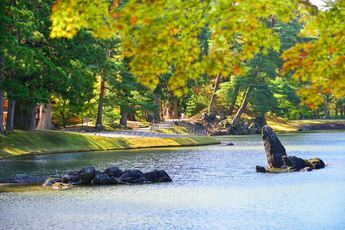 The rocky islet sits at right in Ōizumi-ga-Ike, a pond in the Pure Land Garden.