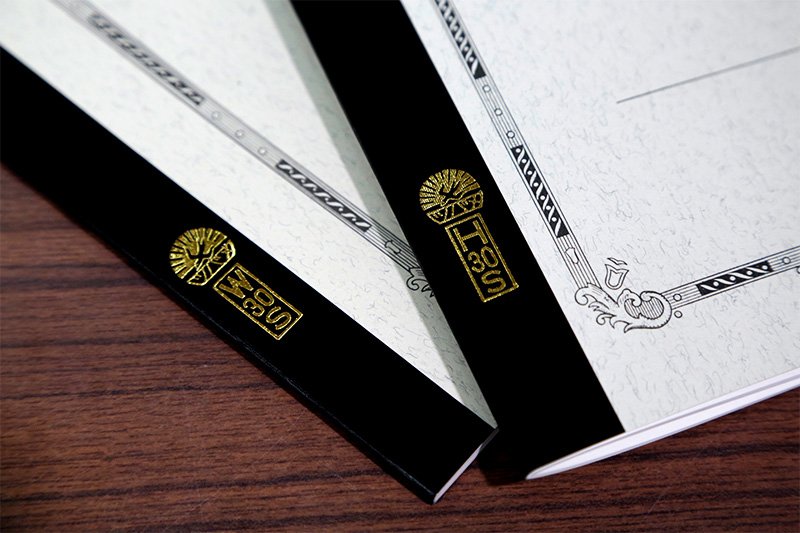 The initials of Tsubame’s founder Watanabe Hatsusaburō are part of the product numbers stamped on the spine of notebooks.