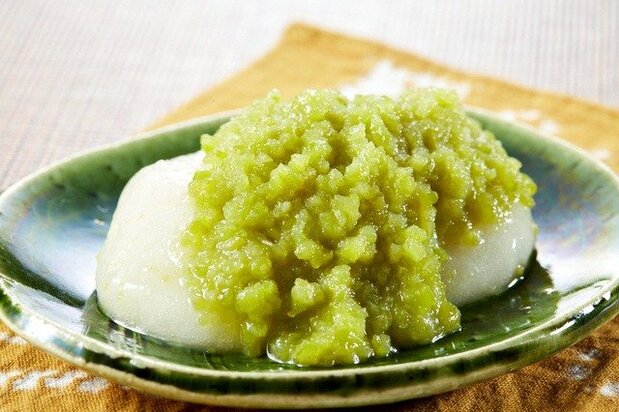 A plate of vivid green zunda mochi.