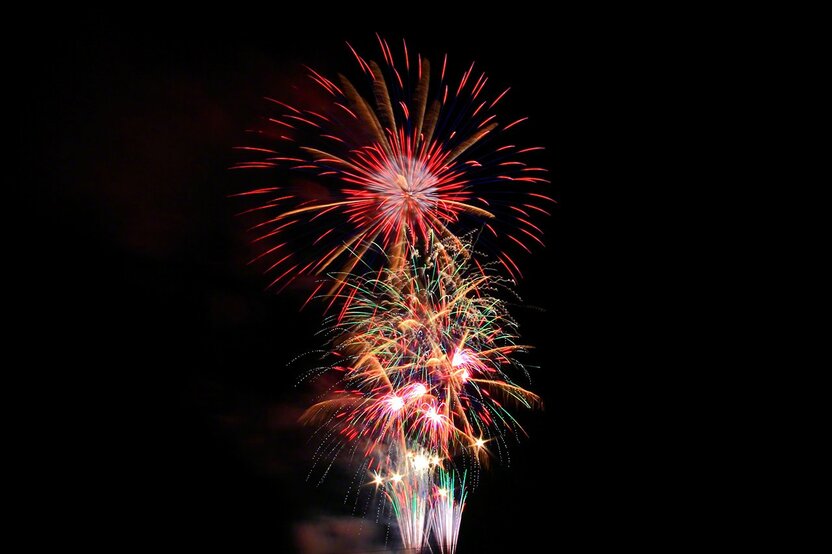 Various brilliant colors overlap in this example of Creative Fireworks.