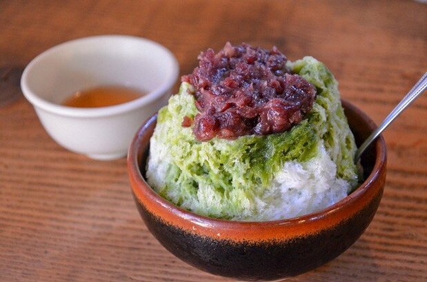 Ujikintoki shaved ice is made with coarse bean paste, matcha, and sugary syrup.