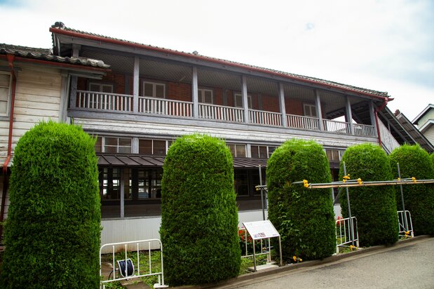 The residence for French female instructors is an elegant timber-framed structure.