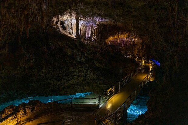 Colored lights enhance the mystical underground atmosphere.
