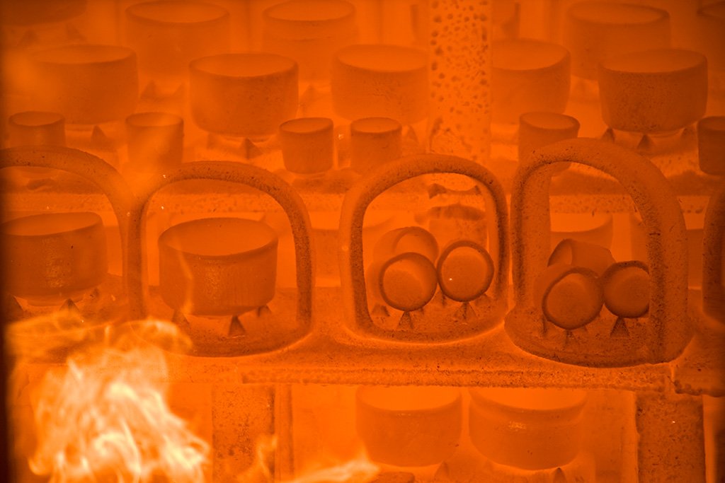 Containers being fired inside the kiln.
