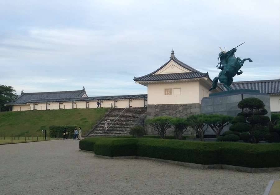 Yamagata castle and statue of former lord Mogami Yoshiaki.