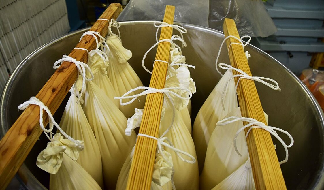 The traditional shizuku-dori method of pressing, using cloth bags, is reserved for top-quality sake. Senkin keeps the equipment refrigerated to prevent oxidation.