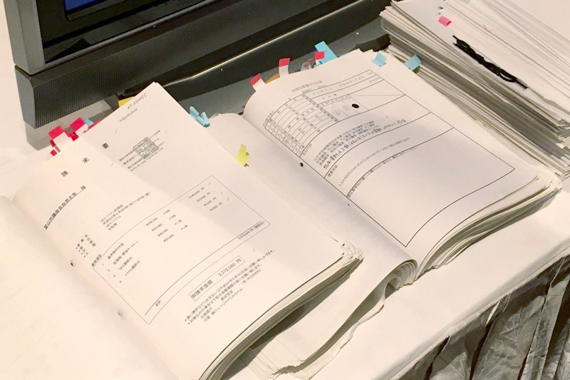 Sheaves of accounting slips with tags on many pages.