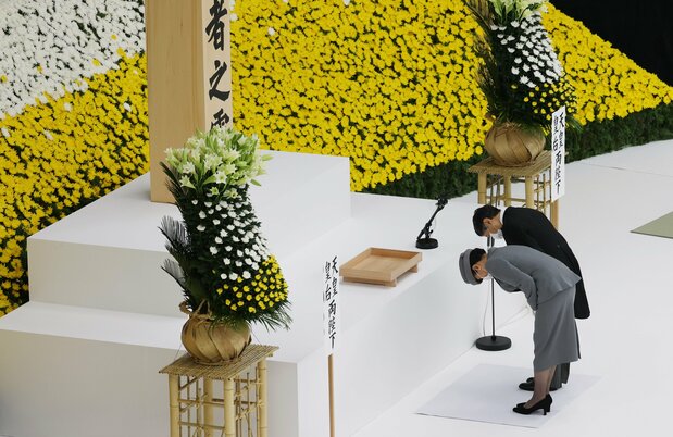 Emperor Naruhito and Empress Masako bow at the National Memorial Service for the War Dead in Tokyo on August 15, 2020. (© Jiji)