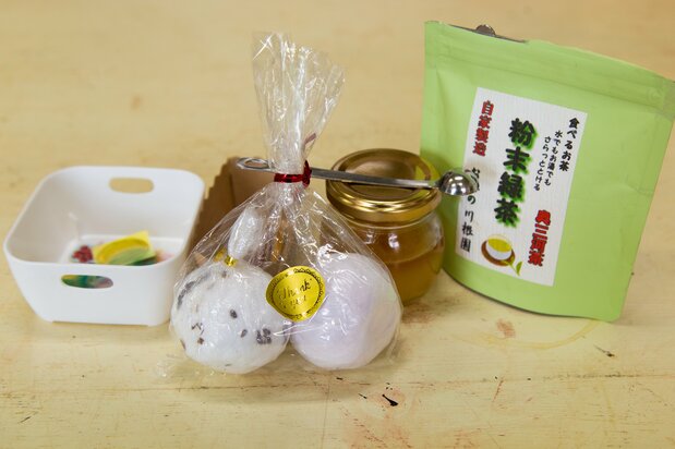 Bath bombs infused with baking soda, citric acid, and honey.
