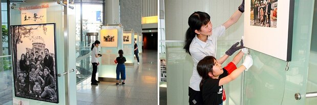 東京・汐留の写真展会場。設営は小学生の娘さんもお手伝い(右)