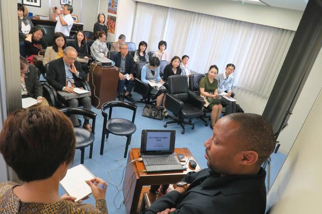 The embassy tea parties are opportunities for familiarizing guests with the host nations, as in this presentation at the Botswanan embassy.