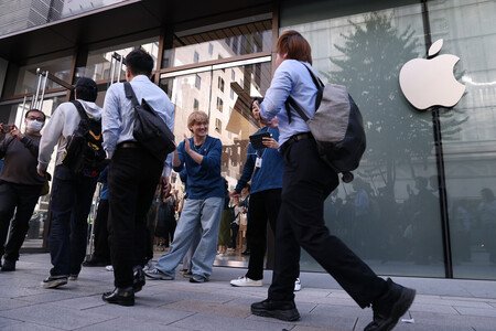 People enter an Apple store in Tokyo on Friday morning as sales of the iPhone Duo foldable smartphone begin.
