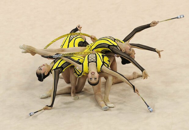Japan performs in the hoops and clubs event during the group qualifying round for the Beijing Olympics. They missed out on advancing to the top eight after placing tenth, on August 22, 2008. (© Jiji)