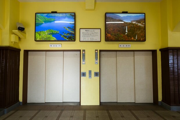 The elevators, each holding up to 30 passengers, travel straight down through solid rock.