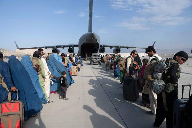 People awaiting evacuation on an American C-17 transport plane at Kabul’s airport. (Courtesy of the US Air Force; © AFP Photo/US Air Force/Master Sgt. Donald R. Allen)