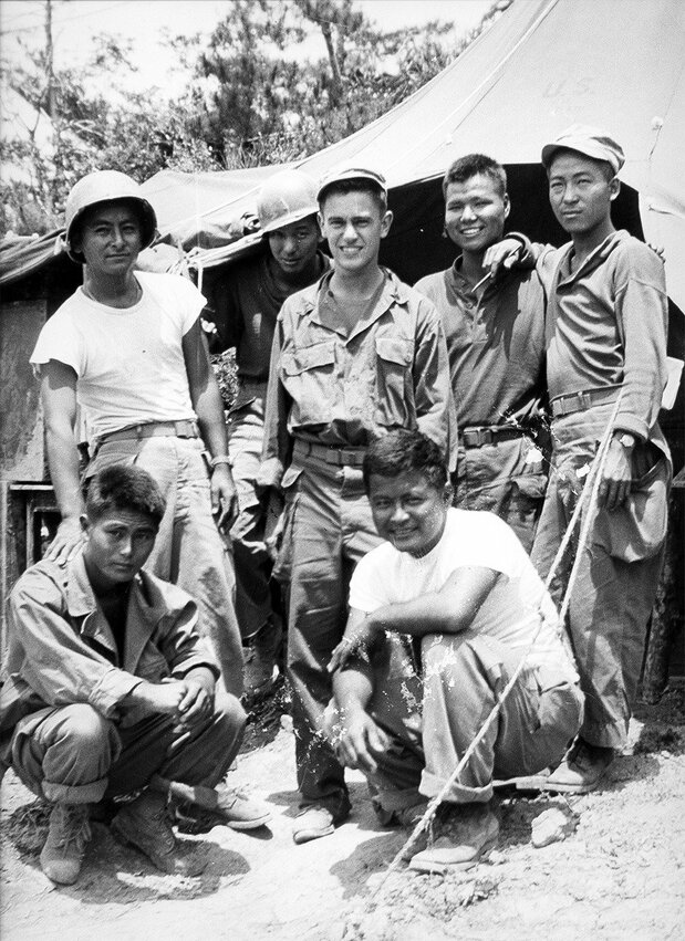 Donald Keene (standing at center) pictured with Japanese-American subordinates during the time he was assigned in Okinawa as a translator and interpreter from April to July 1945. (Courtesy Donald Keene Center Kashiwazaki)