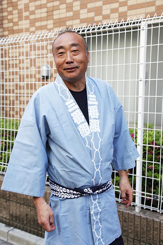 神輿を組んで30年という頭（かしら）の菊池さん。