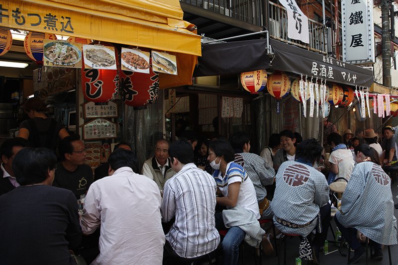 Visitors and locals mingle in one of the many small restaurants that line the streets around Sensōji.