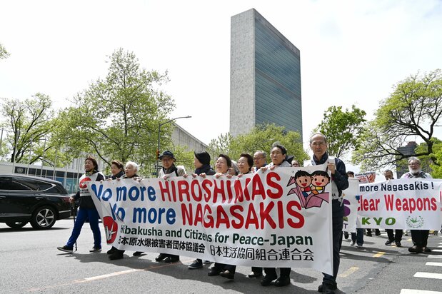 Protesters march outside the United Nations headquarters in New York on April 26, 2026. (© Jiji)