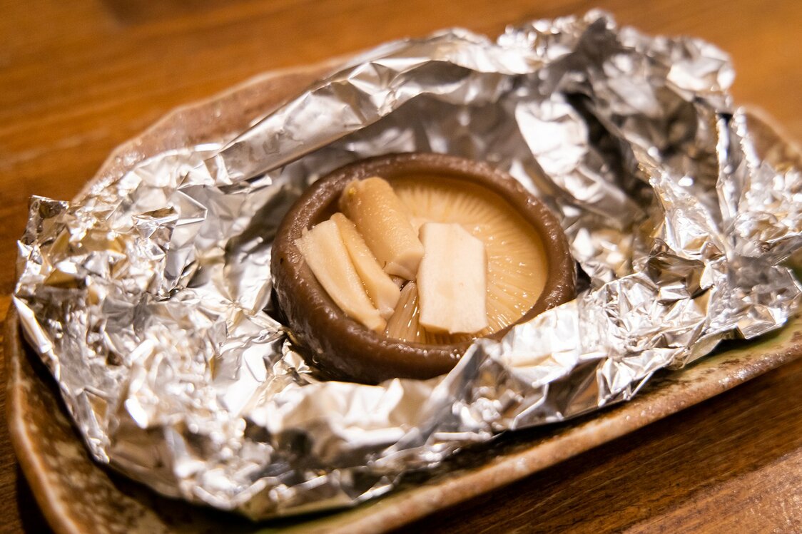 Juicy, foil-baked shiitake is a customer favorite at the Shinoya pubs.