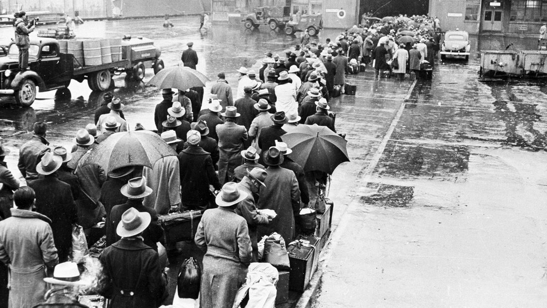Hundreds of people—both Japanese citizens and Americans who had renounced US citizenship—embark for Japan from Seattle in 1945. (Courtesy of the National Archives and Records Administration)
