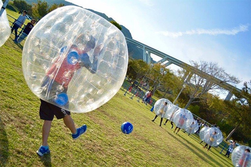 Bubble soccer players take the field.