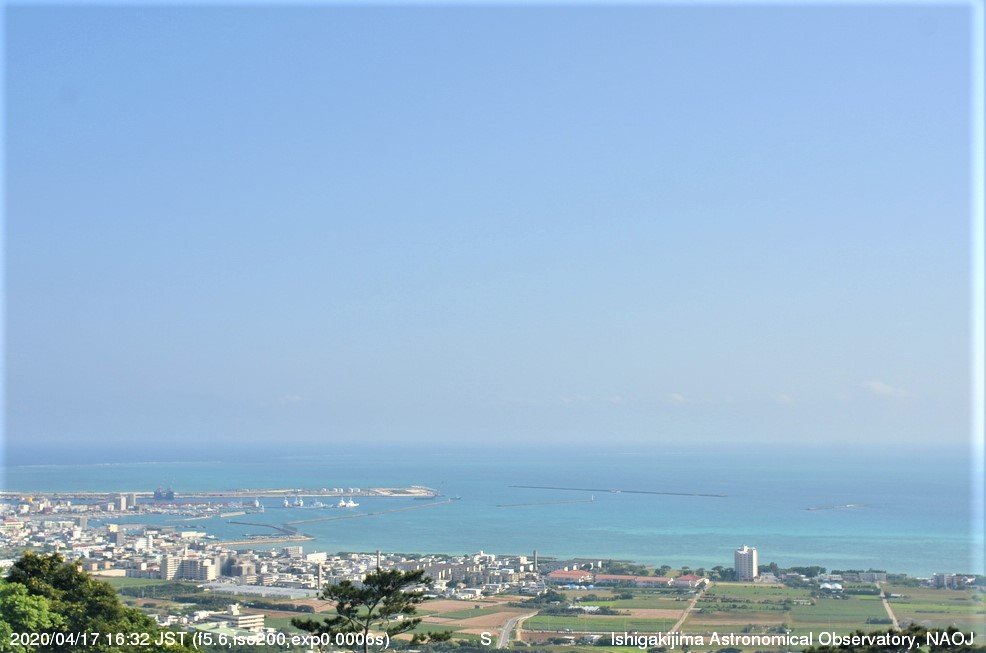 The blue sea and sky are visible during the day.