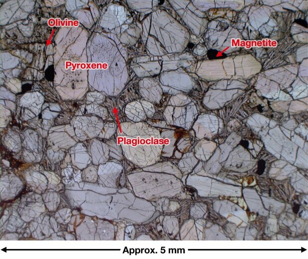 This optical microscope photograph of Yamato 000593 shows that olivine in the rock’s interior has been partially transformed into clay minerals. (Courtesy the National Institute of Polar Research)