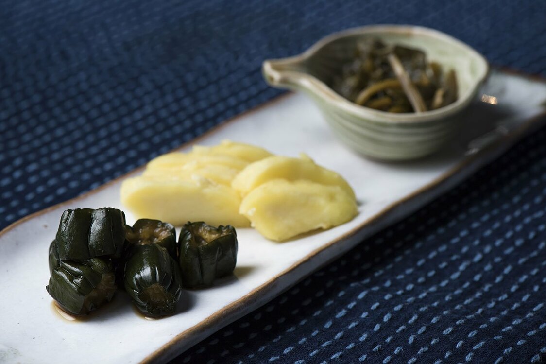 Cucumber pickled in soy sauce, takuan, and pickled wasabi greens.