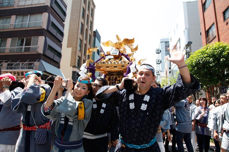 Carrying the “mikoshi” down the Orange Road shopping street.