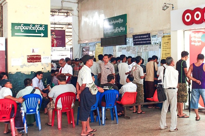 People line up for long-distance train tickets.